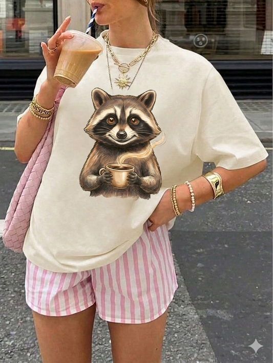 Raccoon Coffee Tee — Cute Woodland Raccoon Holding Mug Graphic T-Shirt